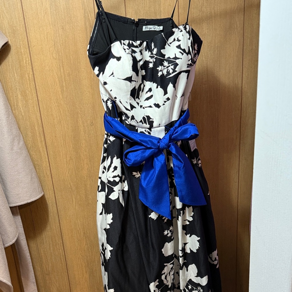 Elegant Black and White Floral Long Dress with Blue Accent Bow